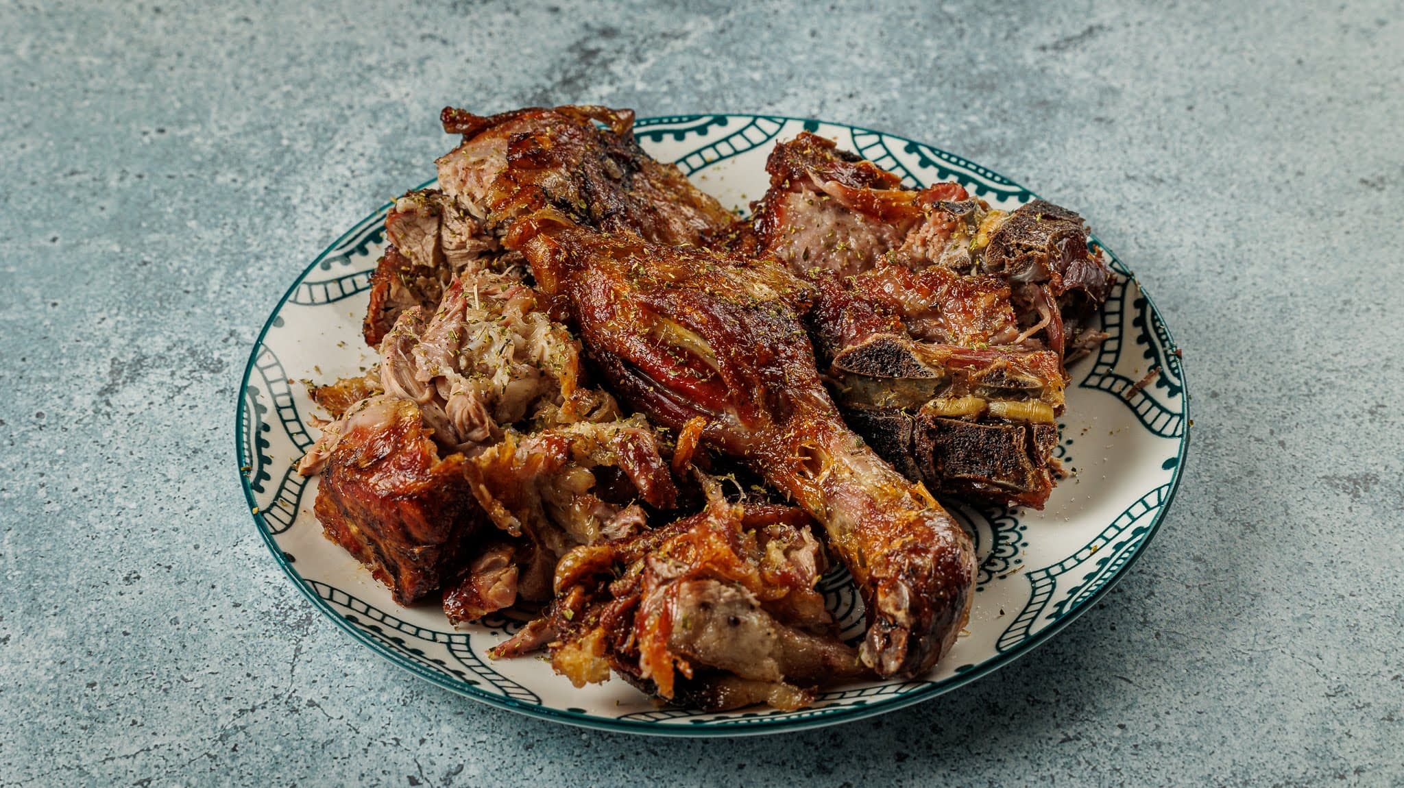 A portion of lamb on the plate